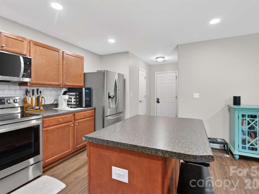 1200 Catawba Run, Lowell, NC 28098.  MLS# CAR4392613, YatesRealty ID 34515. Kitchen to garage and 1/2 bath