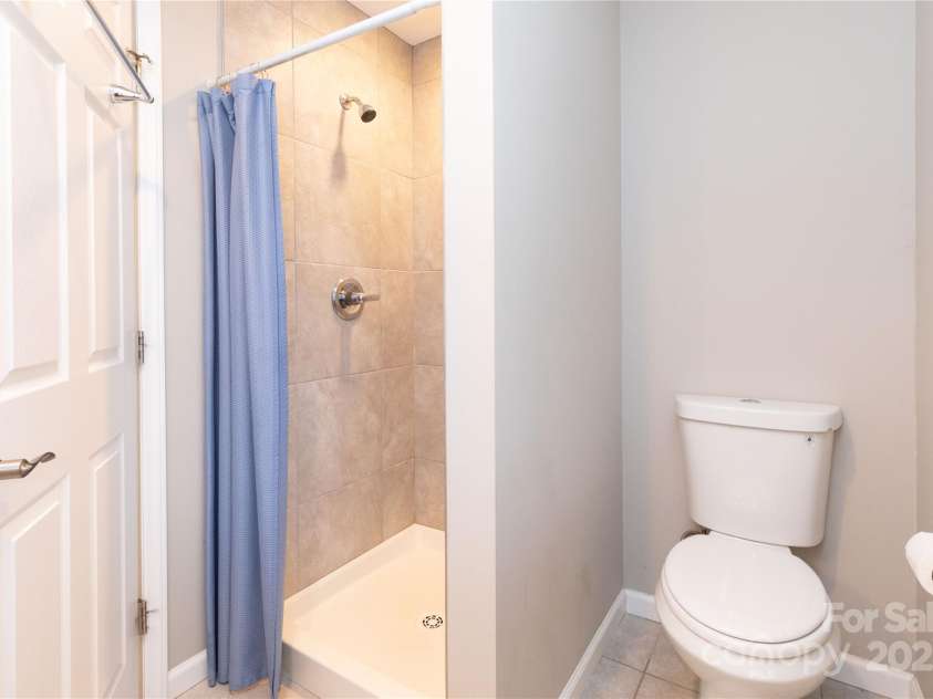 210 State Street, Asheville, NC 28806.  MLS# CAR4218309, YatesRealty ID 3452. Primary bathroom with walk in shower.