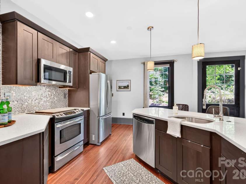 11 Cullowhee Street, Asheville, NC 28801.  MLS# CAR4397859, YatesRealty ID 34522. Fresh, White Counters and Modern Backsplash