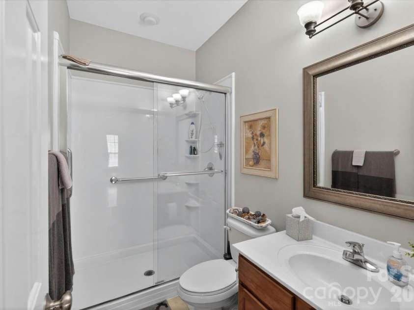 1047 Curry Way, Matthews, NC 28104.  MLS# CAR4388516, YatesRealty ID 34524. Upgraded Bath Fitter Shower