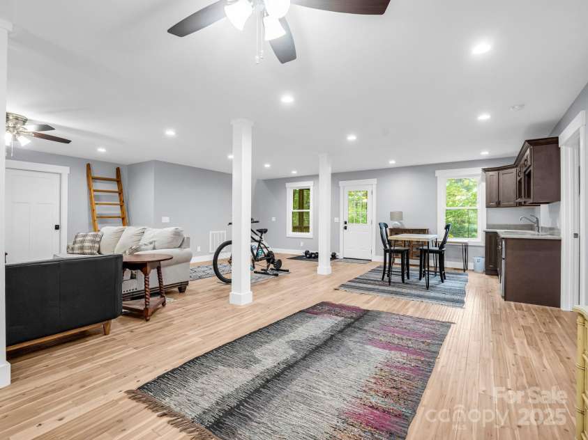 38 Scenic View Drive, Hendersonville, NC 28792.  MLS# CAR4288611, YatesRealty ID 34530. Lower Level Great Room (Previously staged, flooring replaced)