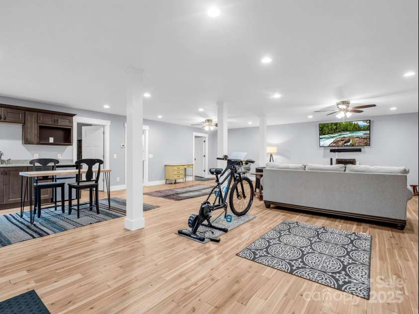 38 Scenic View Drive, Hendersonville, NC 28792.  MLS# CAR4288611, YatesRealty ID 34530. Lower Level Great Room (Previously staged, flooring replaced)