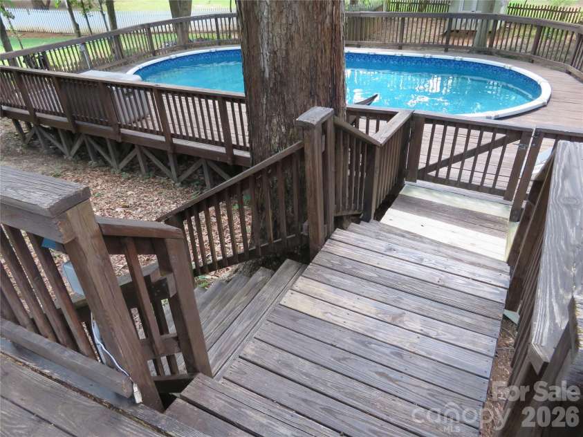 1843 Tanfield Drive, Matthews, NC 28105.  MLS# CAR4396451, YatesRealty ID 34538. . . . which leads down to the pool