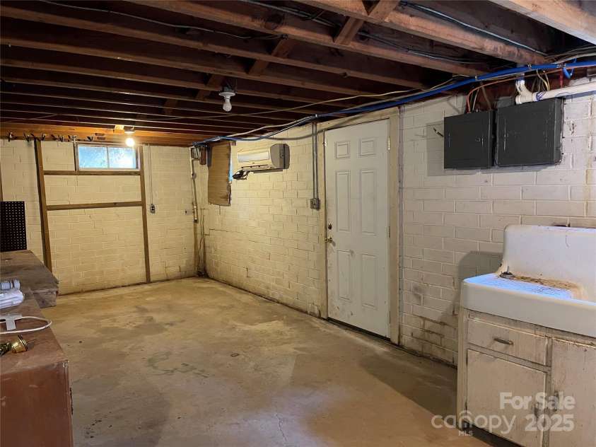8725 Bringle Ferry Road, Salisbury, NC 28146.  MLS# CAR4218468, YatesRealty ID 3454. Exterior basement door at right 