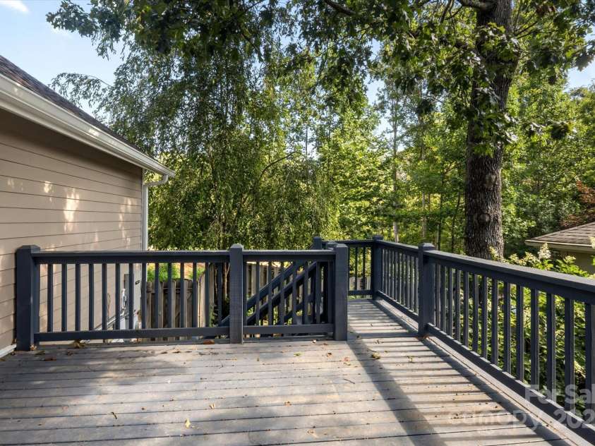 11 Town Circle, Flat Rock, NC 28731.  MLS# CAR4285794, YatesRealty ID 34545. Enjoy quiet retreat on the back deck.