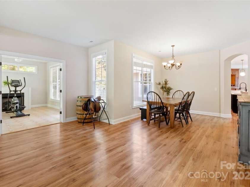 11 Town Circle, Flat Rock, NC 28731.  MLS# CAR4285794, YatesRealty ID 34545. Looking into the front entry and dining room.