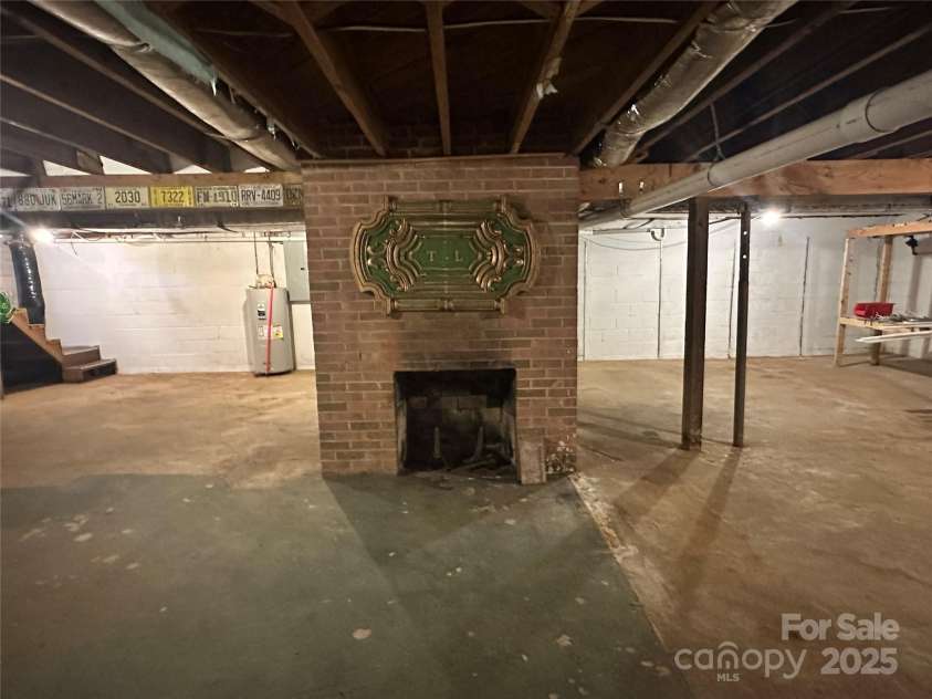 2309 Briarwood Street, Lenoir, NC 28645.  MLS# CAR4292016, YatesRealty ID 34548. Basement with fireplace