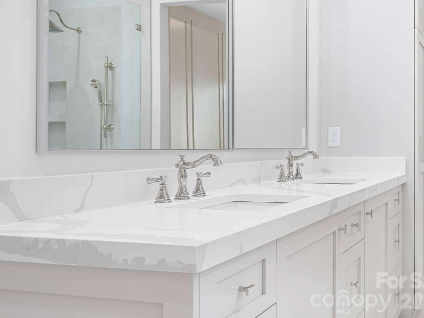 126 Manorly Lane, Mooresville, NC 28115.  MLS# CAR4391858, YatesRealty ID 34565. Oversized mirrors, natural and LED can lighting