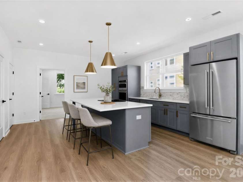 2714 Baltimore Avenue, Charlotte, NC 28203.  MLS# CAR4360205, YatesRealty ID 34577. 2nd floor kitchen virtually staged