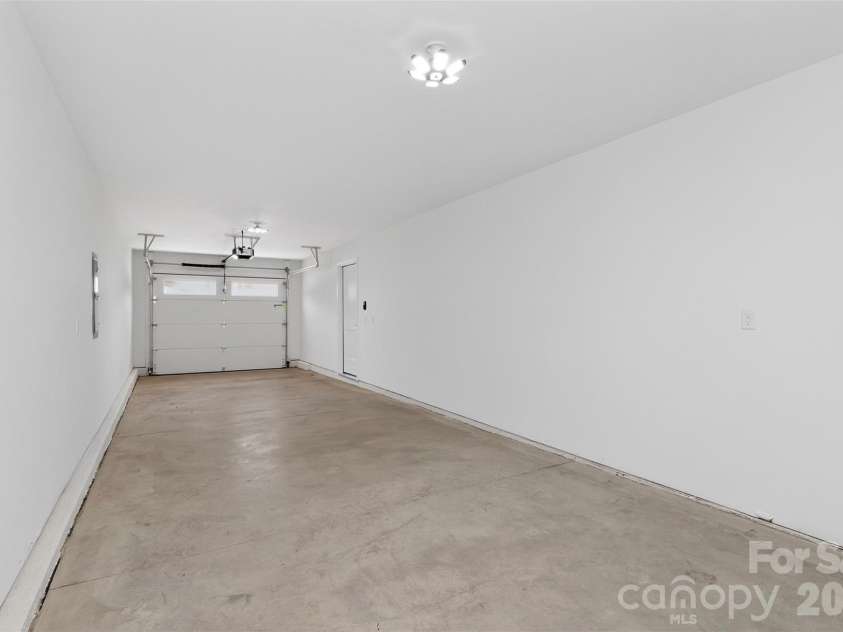 2714 Baltimore Avenue, Charlotte, NC 28203.  MLS# CAR4360205, YatesRealty ID 34577. 39' deep tandem garage on main floor