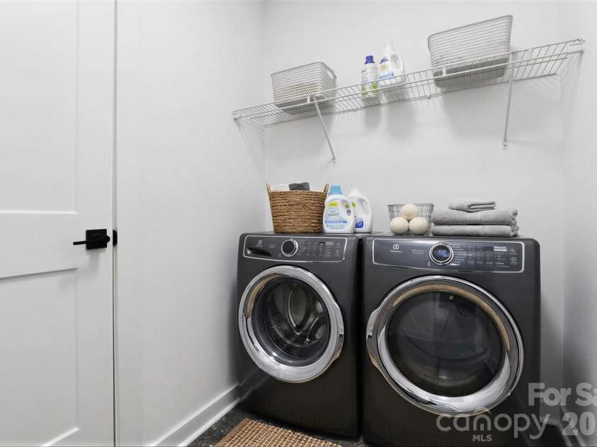 2714 Baltimore Avenue, Charlotte, NC 28203.  MLS# CAR4360205, YatesRealty ID 34577. 3rd floor side by side laundry room virtually staged