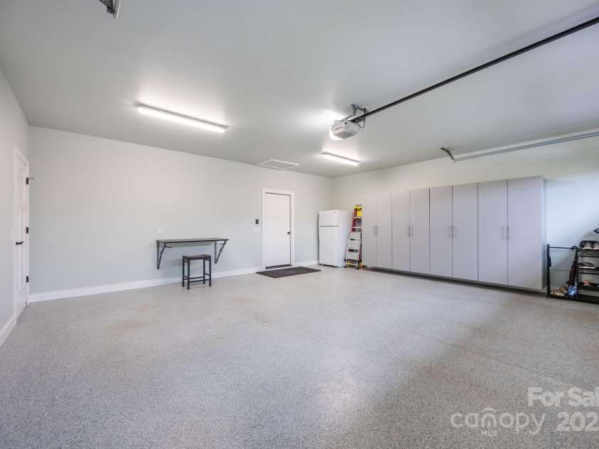45 Penley Park Drive, Weaverville, NC 28787.  MLS# CAR4289463, YatesRealty ID 34577. Oversized garage with cabinets and closet