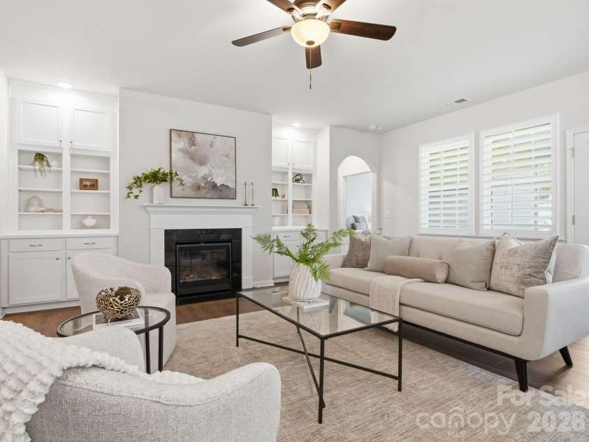 4047 Havenport Circle, Tega Cay, SC 29708.  MLS# CAR4394582, YatesRealty ID 34585. Gas log fireplace with built-in book shelves