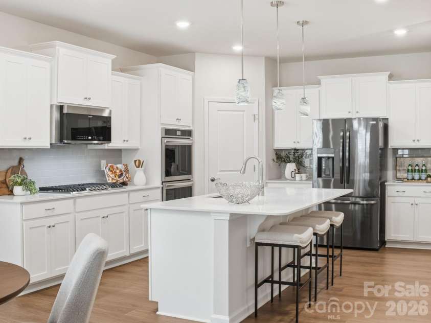 4047 Havenport Circle, Tega Cay, SC 29708.  MLS# CAR4394582, YatesRealty ID 34585. Kitchen island with additional seating