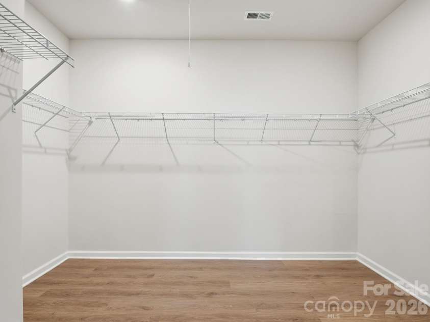 4047 Havenport Circle, Tega Cay, SC 29708.  MLS# CAR4394582, YatesRealty ID 34585. Spacious walk-in closet with attic access