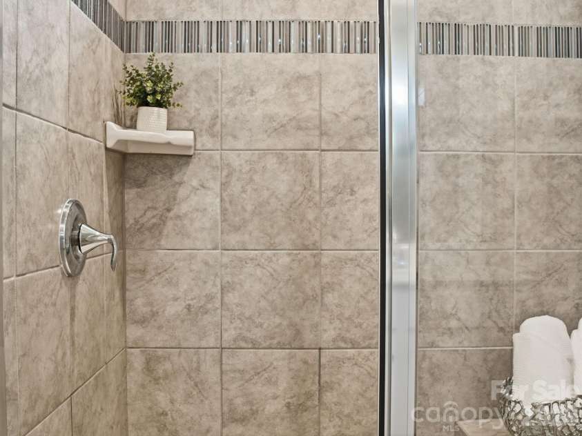 4047 Havenport Circle, Tega Cay, SC 29708.  MLS# CAR4394582, YatesRealty ID 34585. Tile shower