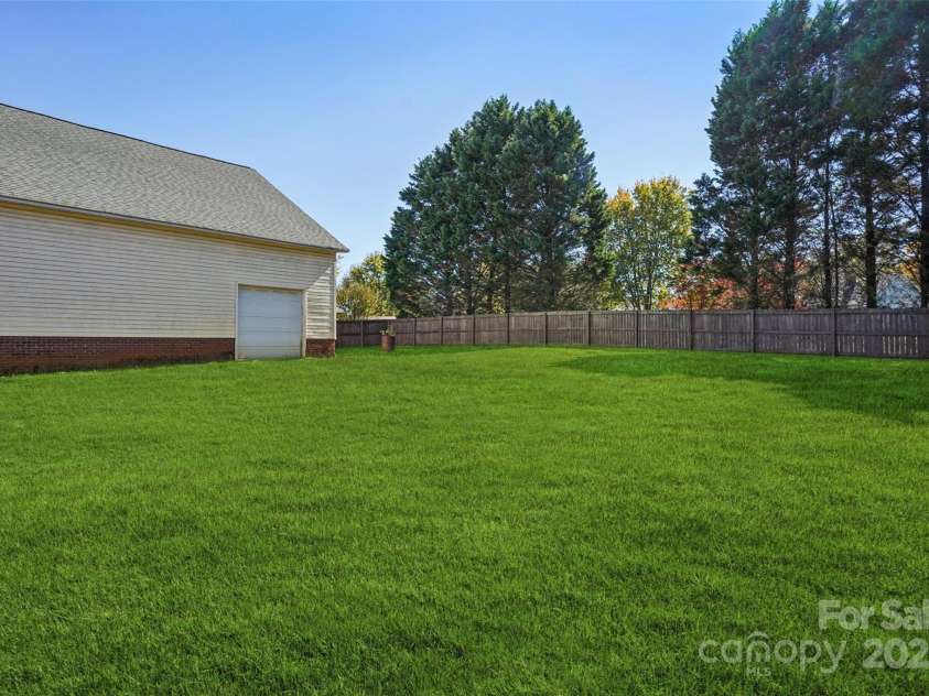 495 Gold Knob Road, Salisbury, NC 28146.  MLS# CAR4312214, YatesRealty ID 34586. Nice level back yard that is fenced with a privacy fence.