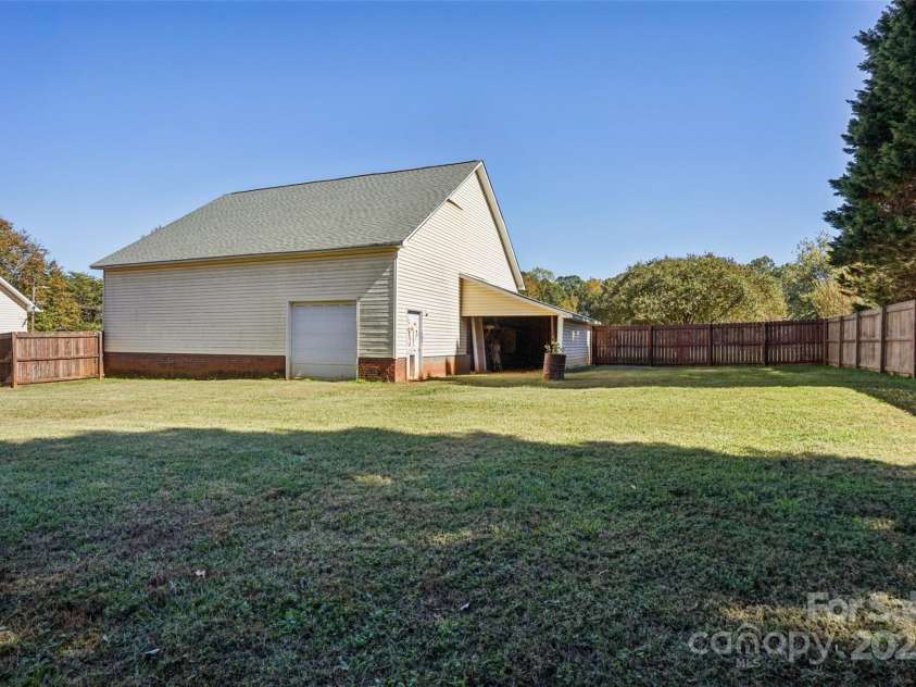 495 Gold Knob Road, Salisbury, NC 28146.  MLS# CAR4312214, YatesRealty ID 34586. Nice level back yard that is fenced with a privacy fence.