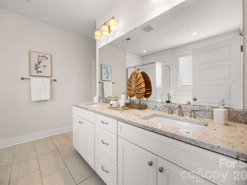 12021 Grey Partridge Drive, Charlotte, NC 28278.  MLS# CAR4396177, YatesRealty ID 34589. This primary bathroom is nice and light!