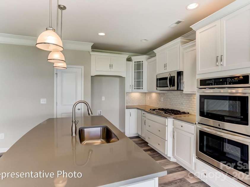 2042 Mantle Ridge Drive, Wesley Chapel, NC 28079.  MLS# CAR4296402, YatesRealty ID 34595. Option to do designer range hood