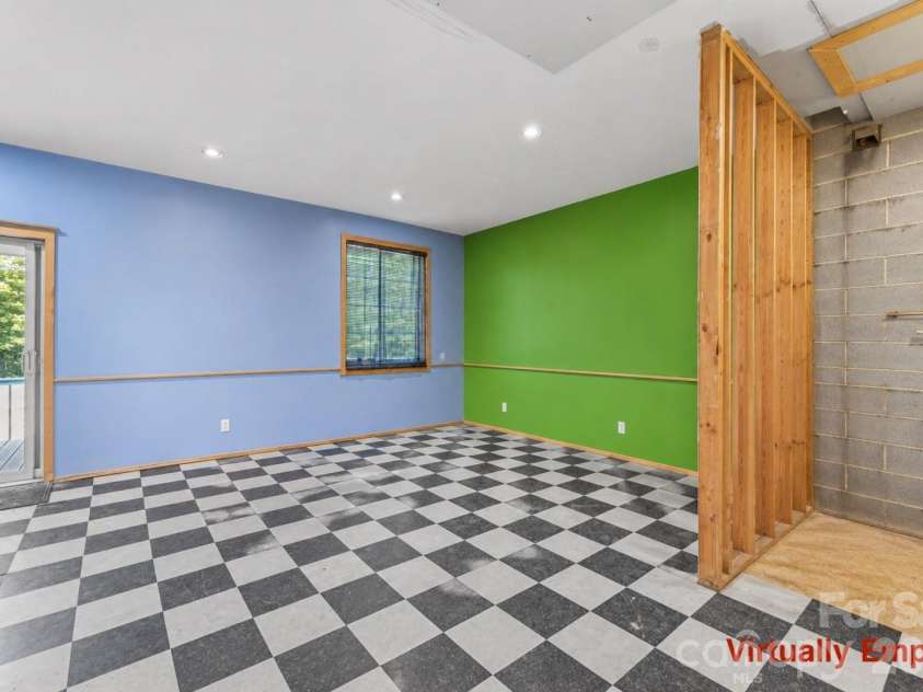 2269 Lee Roy Lane, Lenoir, NC 28645.  MLS# CAR4393336, YatesRealty ID 34595. Virtually Empty Family Room