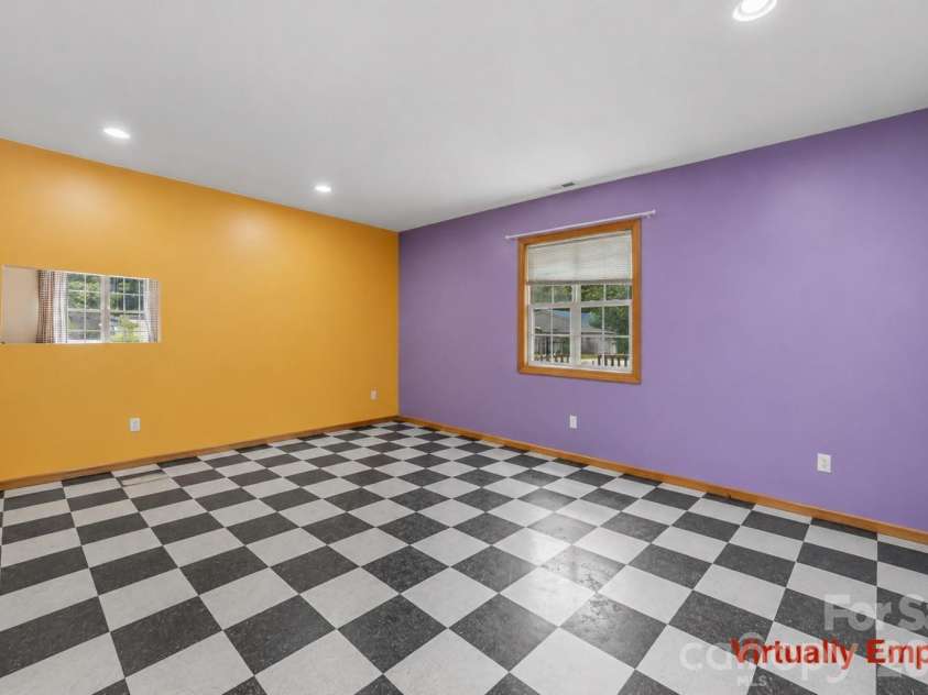 2269 Lee Roy Lane, Lenoir, NC 28645.  MLS# CAR4393336, YatesRealty ID 34595. Virtually Empty Family Room