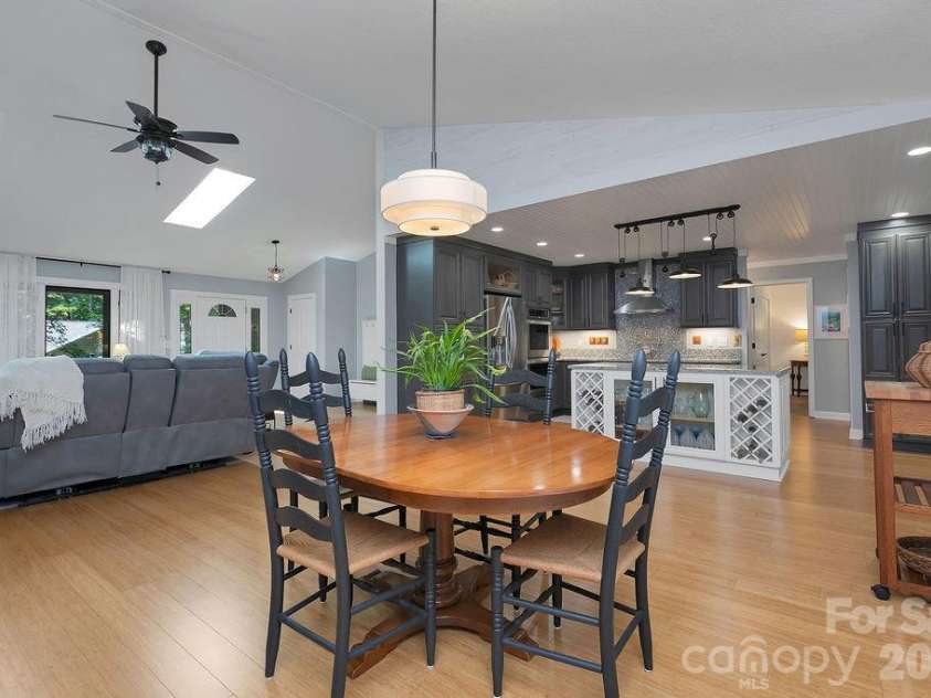 3125 Connestee Trail, Brevard, NC 28712.  MLS# CAR4396358, YatesRealty ID 34599. Dining is open to the living room & kitchen