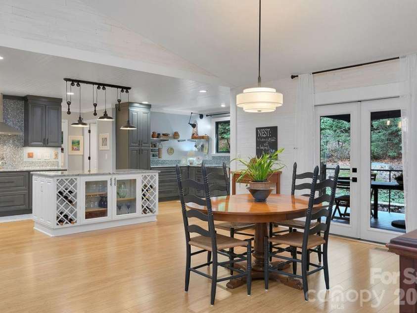 3125 Connestee Trail, Brevard, NC 28712.  MLS# CAR4396358, YatesRealty ID 34599. French doors lead to the back deck
