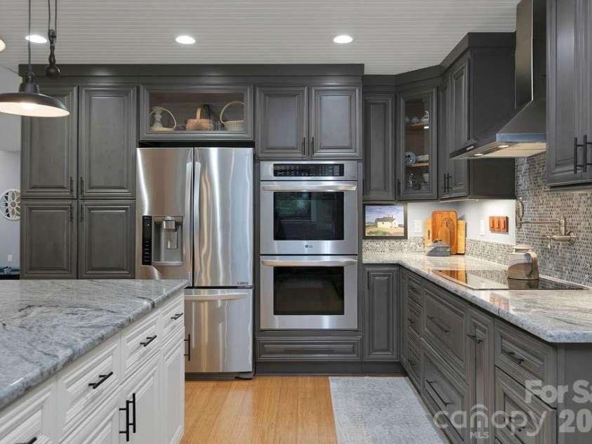 3125 Connestee Trail, Brevard, NC 28712.  MLS# CAR4396358, YatesRealty ID 34599. Granite tops, induction cook top & double oven