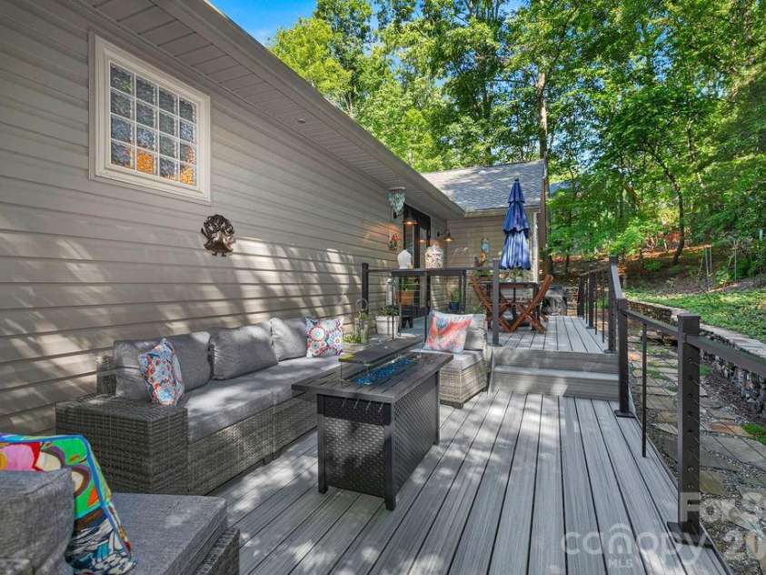 3125 Connestee Trail, Brevard, NC 28712.  MLS# CAR4396358, YatesRealty ID 34599. Or sit around the fire table for a chat? 