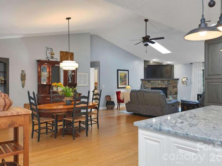 3125 Connestee Trail, Brevard, NC 28712.  MLS# CAR4396358, YatesRealty ID 34599. View from kitchen into great room