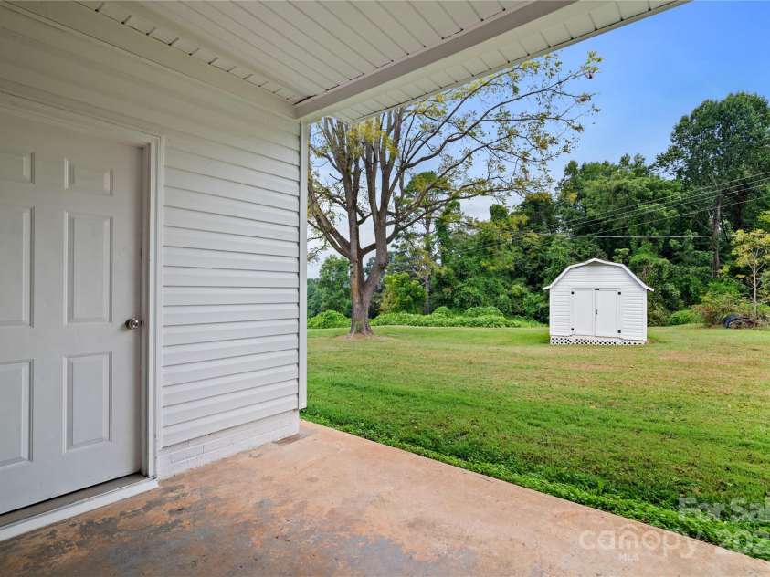 648 Scotts Creek Road, Statesville, NC 28625.  MLS# CAR4298901, YatesRealty ID 346. Back covered porch, exits from large room and also storage closet!
