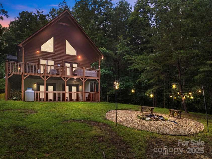 664 Sweetbriar Road, Lake Lure, NC 28746.  MLS# CAR4288832, YatesRealty ID 34604. Back View & Yard at Dusk