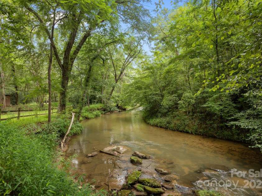 664 Sweetbriar Road, Lake Lure, NC 28746.  MLS# CAR4288832, YatesRealty ID 34604. Creek