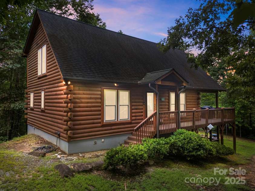 664 Sweetbriar Road, Lake Lure, NC 28746.  MLS# CAR4288832, YatesRealty ID 34604. Front View from Driveway at Dusk