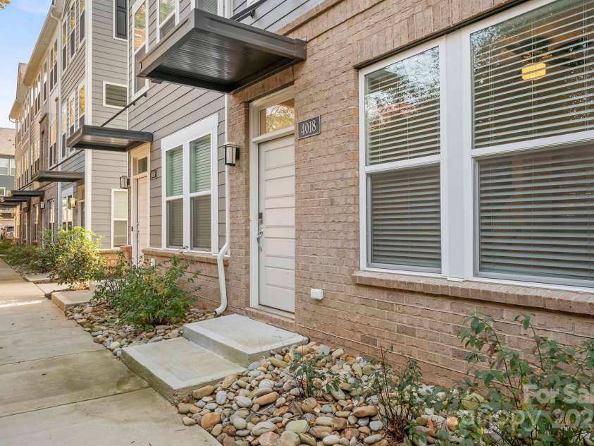 4018 Capital Ridge Court, Charlotte, NC 28205.  MLS# CAR4196575, YatesRealty ID 34613. Front of townhome entrance