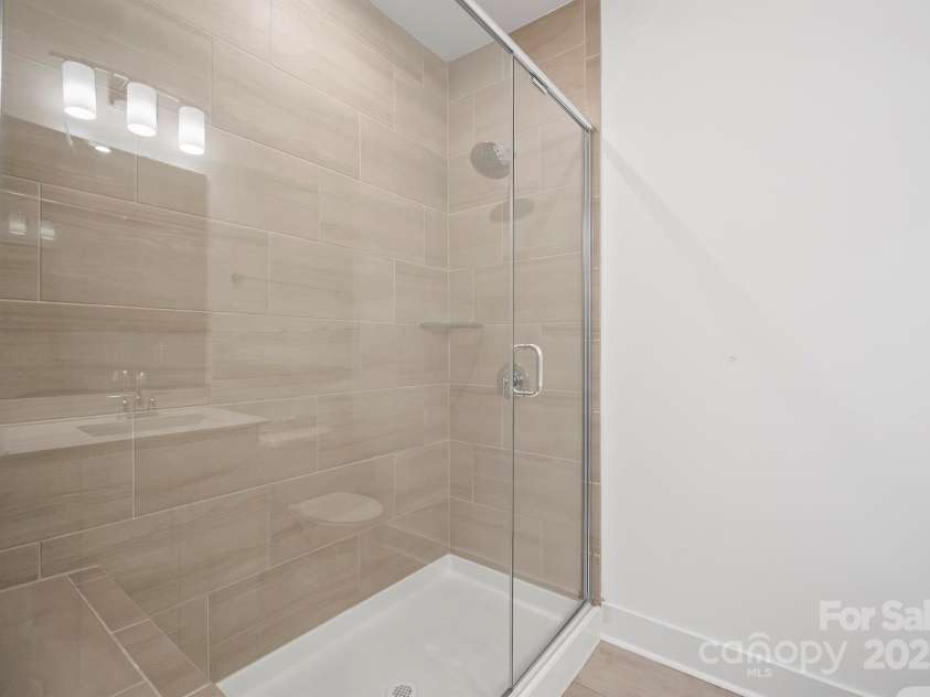 4018 Capital Ridge Court, Charlotte, NC 28205.  MLS# CAR4196575, YatesRealty ID 34613. Walk-in shower in primary bath
