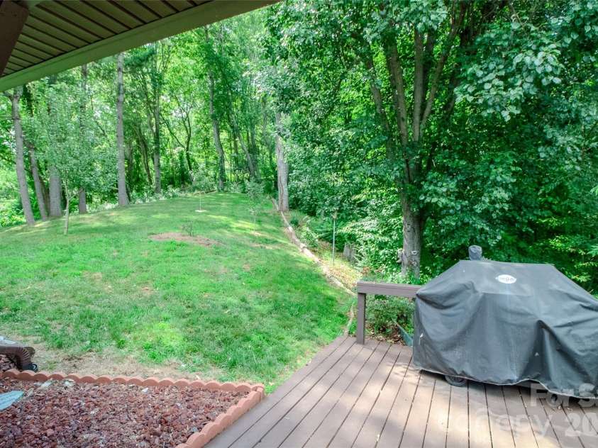 49 Jake Drive, Canton, NC 28716.  MLS# CAR4398234, YatesRealty ID 34618. Back yard patio with grill. 