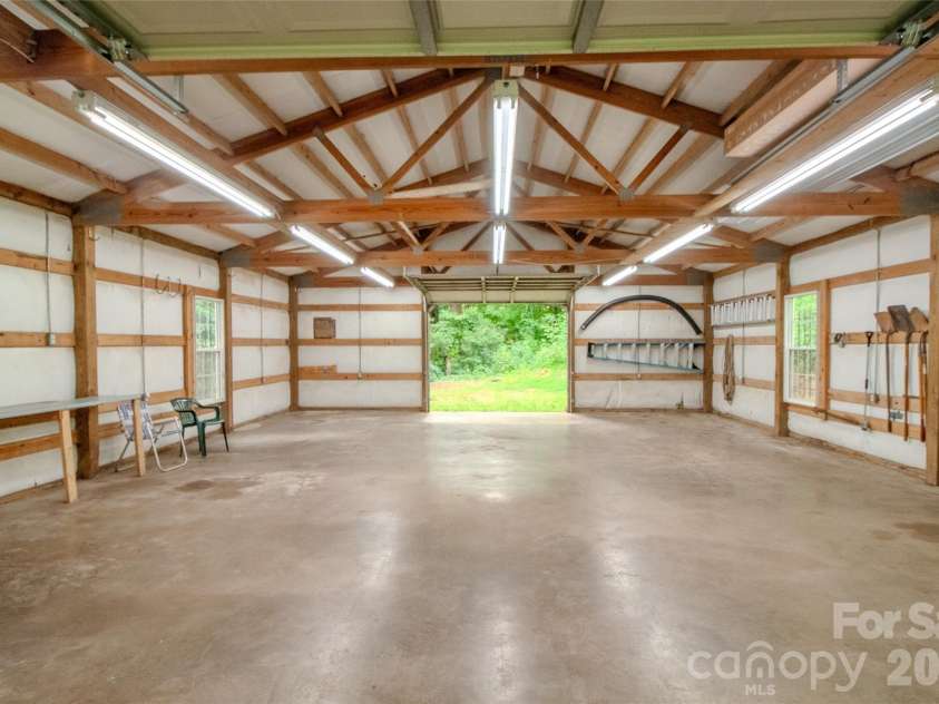 49 Jake Drive, Canton, NC 28716.  MLS# CAR4398234, YatesRealty ID 34618. Inside the workshop looking toward the back door.
