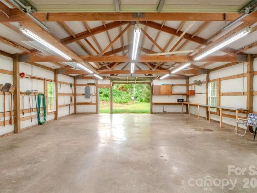 49 Jake Drive, Canton, NC 28716.  MLS# CAR4398234, YatesRealty ID 34618. Inside the workshop looking towards the front door and driveway