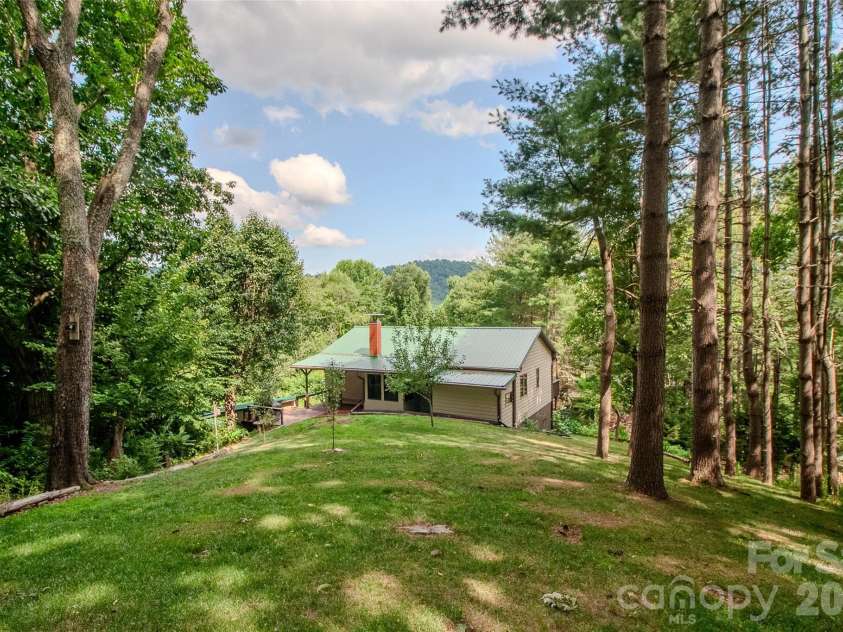 49 Jake Drive, Canton, NC 28716.  MLS# CAR4398234, YatesRealty ID 34618. Wider angle view of the house from the back yard.