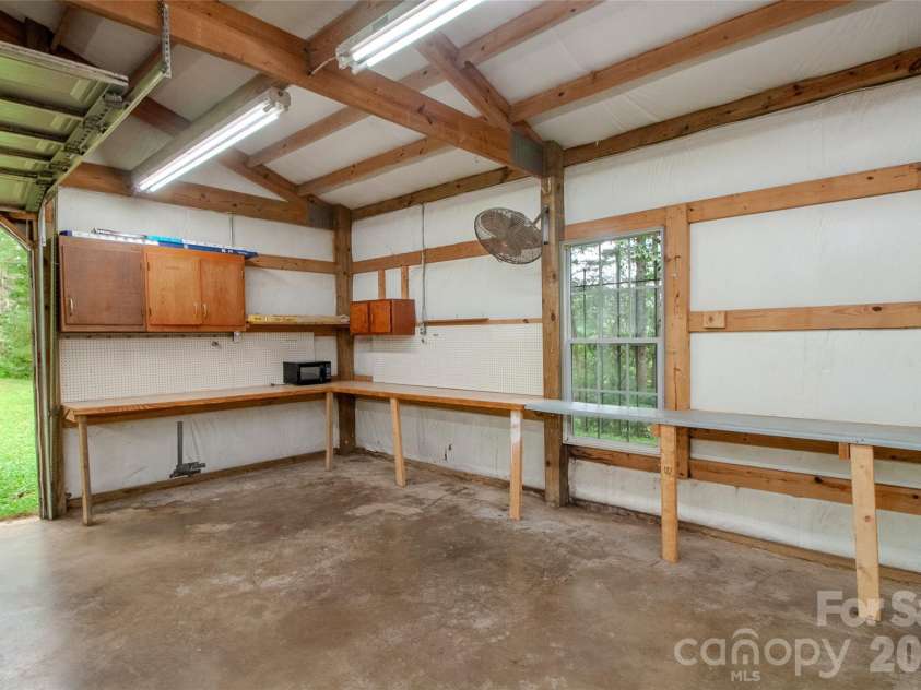 49 Jake Drive, Canton, NC 28716.  MLS# CAR4398234, YatesRealty ID 34618. Work benches in workshop.