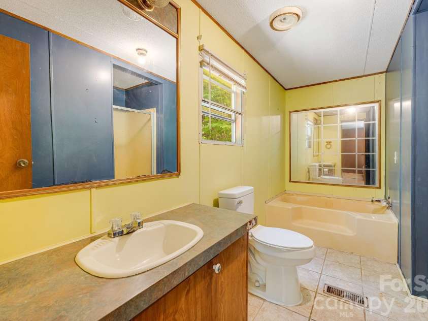 94 Long Ridge Road, Candler, NC 28715.  MLS# CAR4385586, YatesRealty ID 34628. Huge primary bathroom!