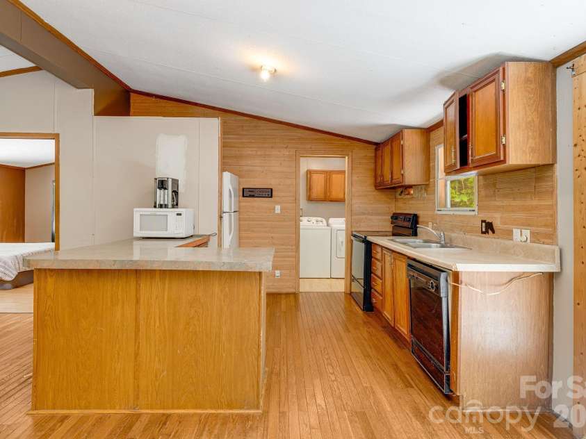 94 Long Ridge Road, Candler, NC 28715.  MLS# CAR4385586, YatesRealty ID 34628. Open kitchen makes entertaining a breeze.