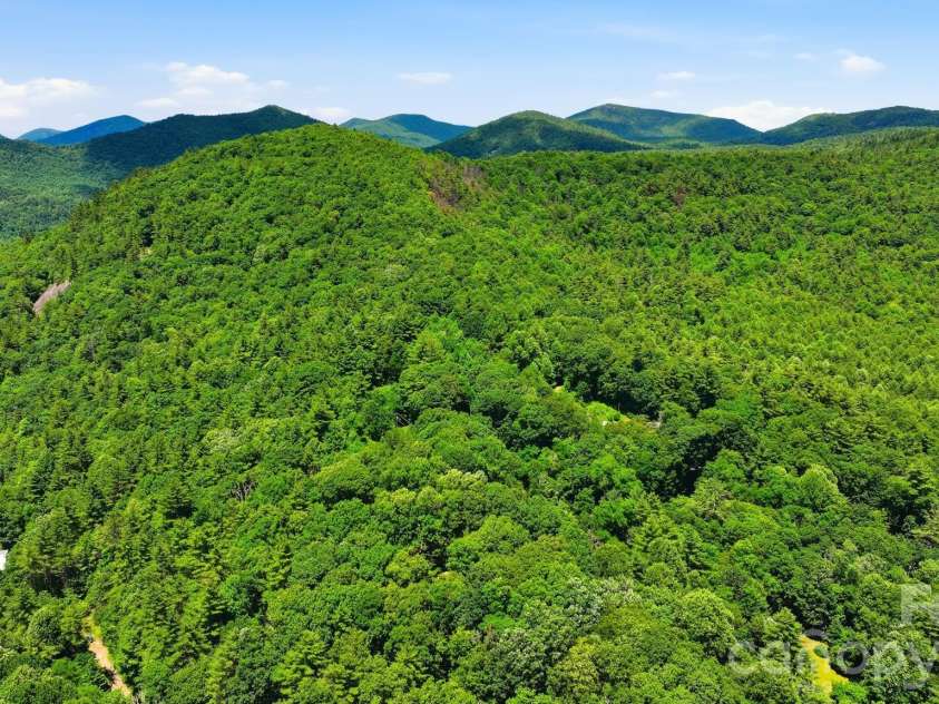 3819 Flat Mountain Road, Highlands, NC 28741.  MLS# CAR4397465, YatesRealty ID 34629. Enjoy breathtaking long-range mountain views that create an unforgettable backdrop for every season.