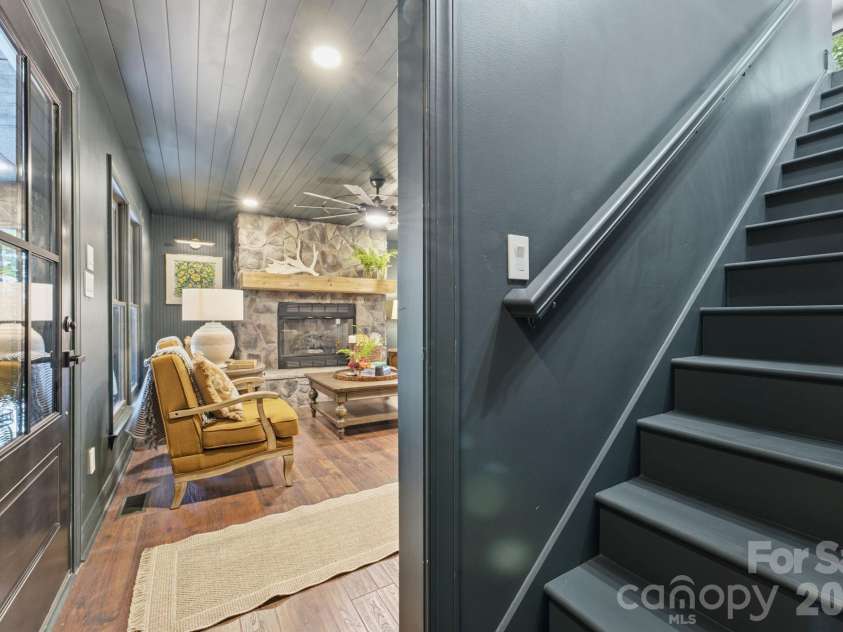 3819 Flat Mountain Road, Highlands, NC 28741.  MLS# CAR4397465, YatesRealty ID 34629. Thoughtfully designed, the staircase leads to the home's private upper-level retreat while complementing the open-concept floor plan.