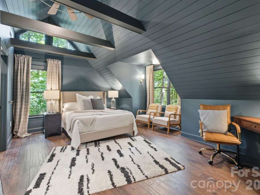 3819 Flat Mountain Road, Highlands, NC 28741.  MLS# CAR4397465, YatesRealty ID 34629. Vaulted ceilings with exposed wood beams create a warm and inviting guest suite, complete with the privacy of its own ensuite bath.