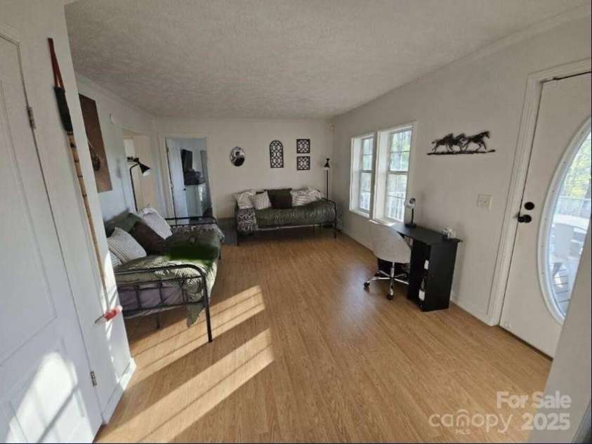 1597 Cleghorn Mill Road, Rutherfordton, NC 28139.  MLS# CAR4213254, YatesRealty ID 3463. Another gathering area also used for more sleeping arrangements.