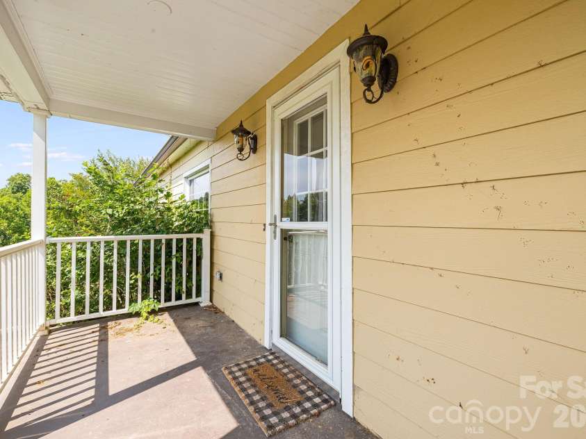 111 Bible School Road, Lake Lure, NC 28746.  MLS# CAR4399262, YatesRealty ID 34637. Exit to porch