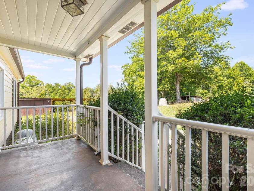 111 Bible School Road, Lake Lure, NC 28746.  MLS# CAR4399262, YatesRealty ID 34637. Front porch